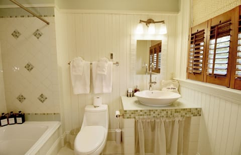 Deluxe Room, 2 Queen Beds | Bathroom | Hair dryer, towels