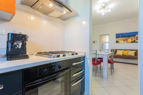 Apartment, Balcony, City View | Private kitchen | Full-size fridge, oven, stovetop, dishwasher