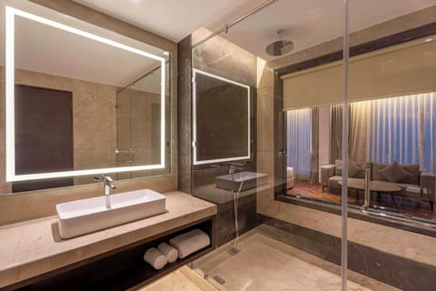 Premium Suite | Bathroom | Shower, hair dryer, slippers, soap