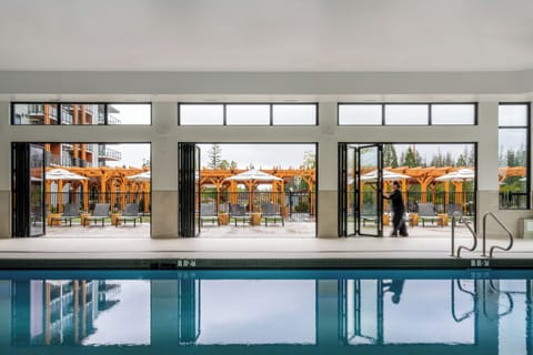 Indoor pool, pool umbrellas, sun loungers