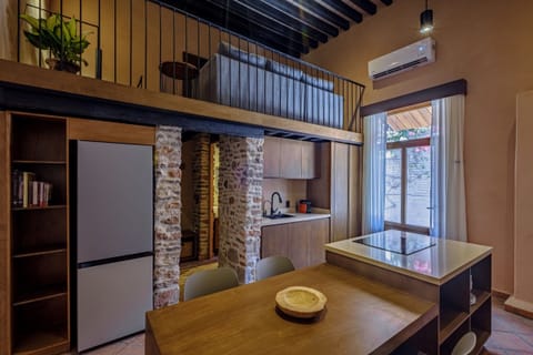 Luxury Studio Suite, Courtyard View | Living area | TV