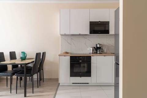 Apartment, Balcony | Private kitchenette | Fridge, stovetop, coffee/tea maker, electric kettle