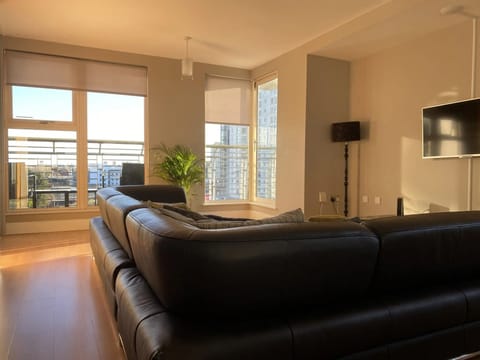 Superior Apartment, Balcony, City View | Living area | 50-inch Smart TV with digital channels, Netflix, streaming services