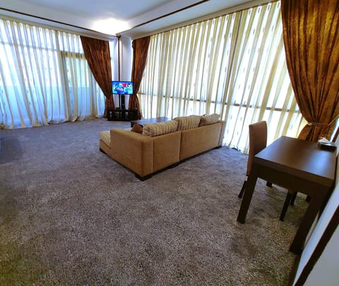 Quadruple Suite | Living area | 36-inch LCD TV with premium channels