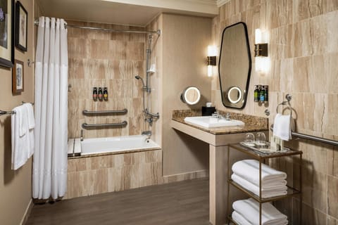 Combined shower/tub, designer toiletries, hair dryer, towels