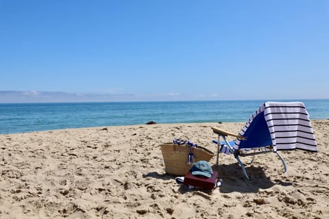 Beach nearby, white sand, beach towels