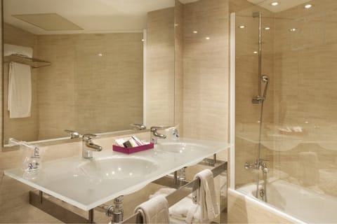 Bathtub, eco-friendly toiletries, hair dryer, bidet