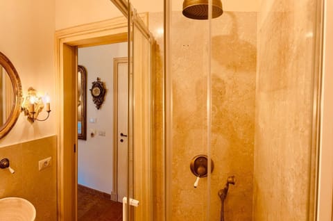 Luxury Double Room, Courtyard View | Bathroom | Shower, hair dryer, bathrobes, slippers