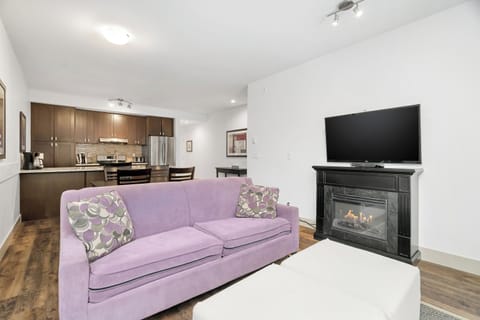 Comfort Apartment, Lake View | Living area | 55-inch Smart TV with cable channels