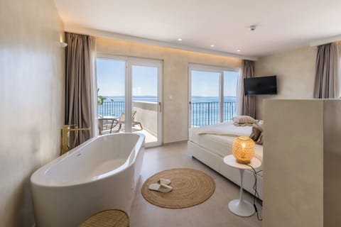 Suite, Balcony, Sea View | Hypo-allergenic bedding, minibar, in-room safe, desk