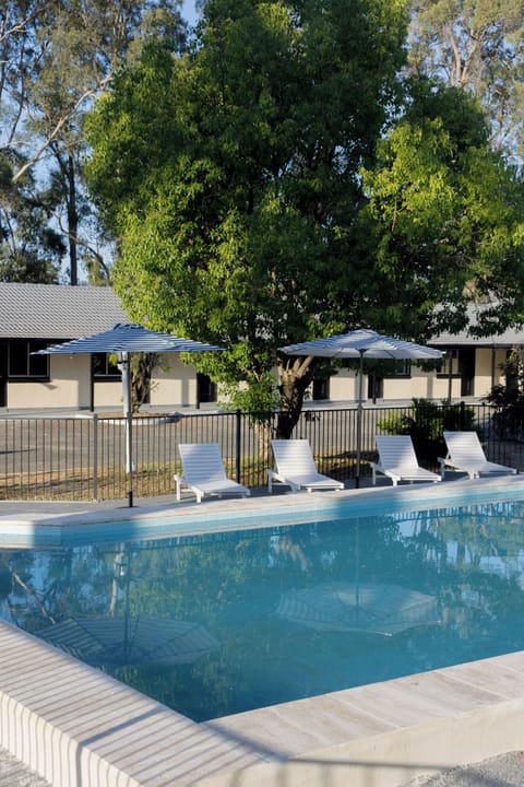 Outdoor pool, pool umbrellas, sun loungers