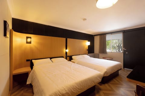 Deluxe Twin Room | Desk, blackout drapes, iron/ironing board, free WiFi