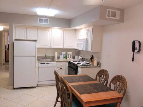 Deluxe Condo | Private kitchen | Full-size fridge, microwave, oven, stovetop