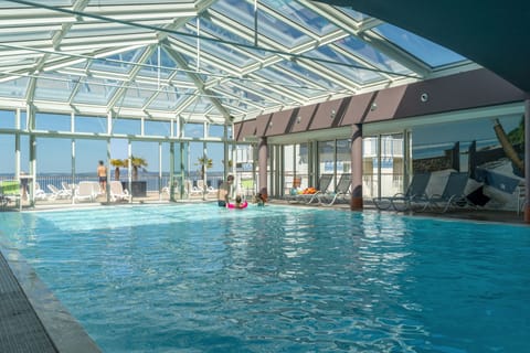 Indoor pool, pool umbrellas, sun loungers