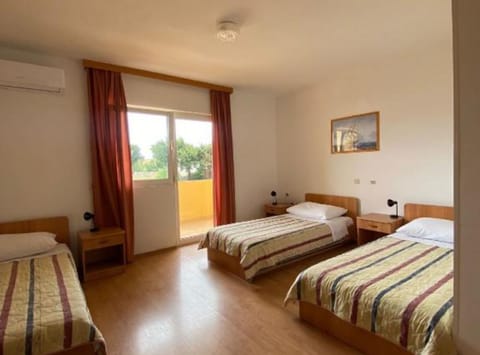 Quadruple Room (Quadruple Room with Balcony 110) | 14 bedrooms, cribs/infant beds, free WiFi