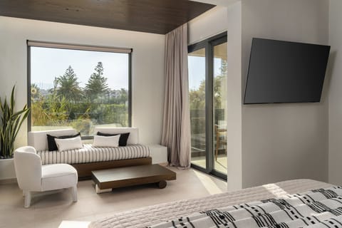 One-Bedroom Suite with Outdoor Jacuzzi | Living area | 55-inch Smart TV with satellite channels, TV