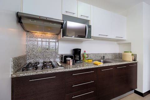 Deluxe Apartment, Private Bathroom, Sea View | Private kitchen | Full-size fridge, microwave, coffee/tea maker, electric kettle