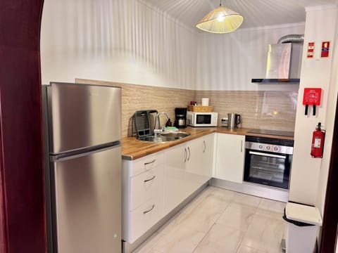 Deluxe Duplex, Partial Sea View | Private kitchen | Full-size fridge, microwave, oven, stovetop