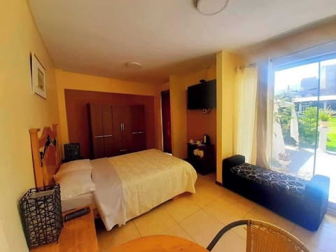 Comfort Room, Patio, Garden View | Individually furnished, desk, laptop workspace, free WiFi