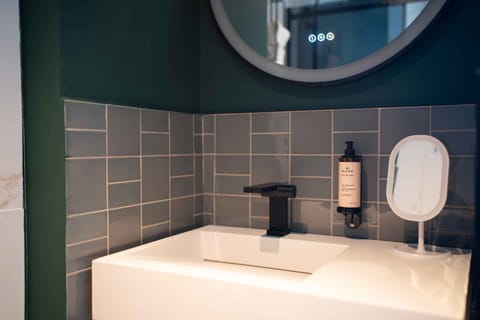 Shower, hair dryer, slippers, towels