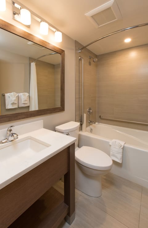 Family Suite, 2 Queen Beds | Bathroom | Combined shower/tub, eco-friendly toiletries, hair dryer, towels