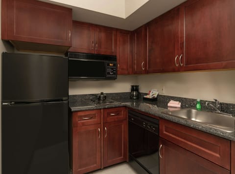 One King Bed, Non-Smoking, with Fireplace | Private kitchen | Full-size fridge, microwave, stovetop, dishwasher