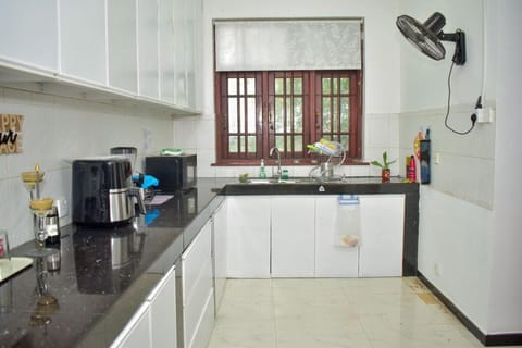 Villa | Private kitchen | Fridge, microwave, oven, stovetop