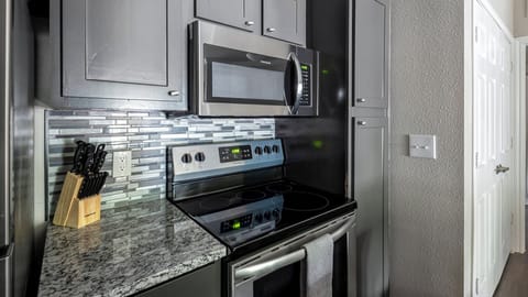 Apartment, 1 Bedroom | Private kitchen | Full-size fridge, oven, stovetop, dishwasher