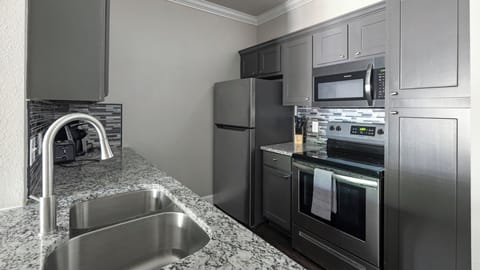 Apartment, 1 Bedroom | Private kitchen | Full-size fridge, oven, stovetop, dishwasher