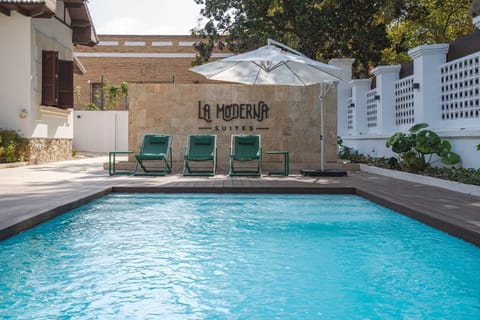 Outdoor pool, open 10:00 AM to 10:00 PM, pool umbrellas, sun loungers