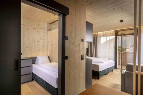 Family Suite, Balcony, Garden View | In-room safe, free WiFi, bed sheets