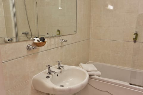 Combined shower/tub, hair dryer, towels, soap