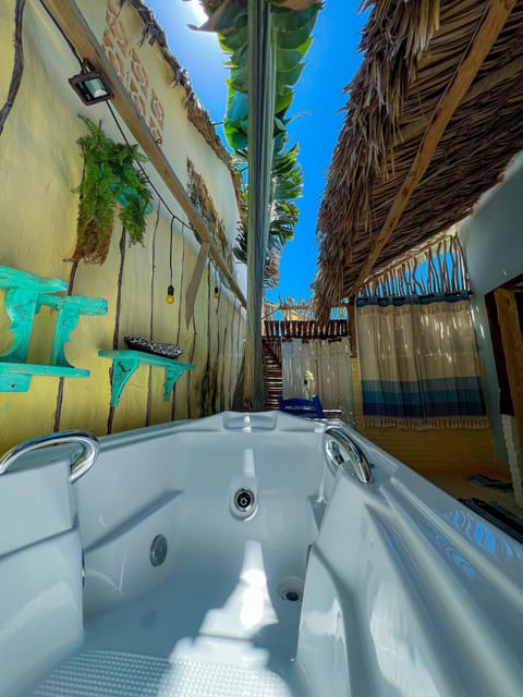 Deluxe Suite, Sea View | Private spa tub