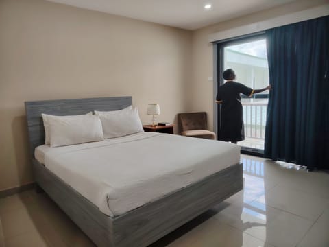 Deluxe Room, Balcony, Mountain View | In-room safe, desk, laptop workspace, iron/ironing board