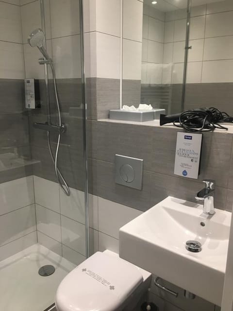 Shower, eco-friendly toiletries, hair dryer, towels