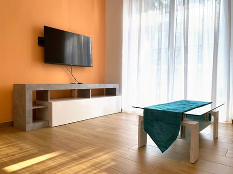 One Bedroom Apartment | Living area | 32-inch flat-screen TV with digital channels