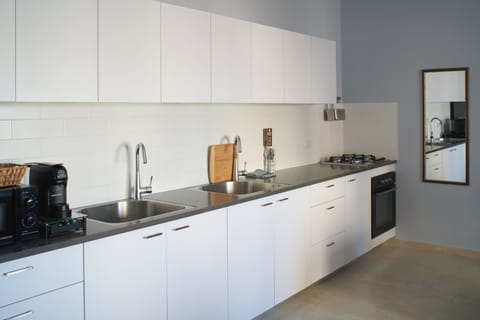 Design Apartment, Balcony, City View | Private kitchen | Full-size fridge, microwave, oven, stovetop