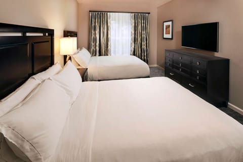 Premium bedding, down comforters, pillowtop beds, in-room safe