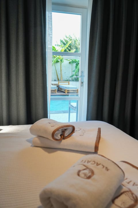 Comfort Room, Pool View | In-room safe, blackout drapes, soundproofing, free WiFi