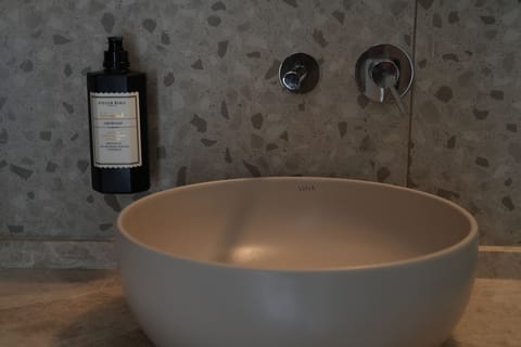 Shower, hair dryer, slippers, towels