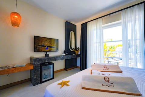 Deluxe Room, Balcony, Pool View | In-room safe, blackout drapes, soundproofing, free WiFi