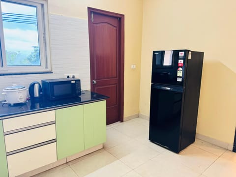 Apartment, City View | Private kitchen | Fridge, electric kettle