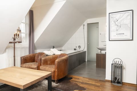 Suite, 1 King Bed, Non Smoking, Fireplace | Living area | 31-inch flat-screen TV with digital channels, TV