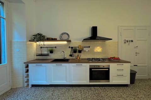 Family Apartment, 4 Bedrooms, Beachside (Giardino Floreale di Menaggio) | Private kitchen | Fridge, microwave, oven, stovetop