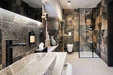 Superior Double Room, Courtyard View | Bathroom | Shower, hair dryer, slippers, towels