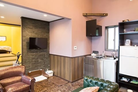 Room, Multiple Beds, Non Smoking, Private Bathroom | Living area | Flat-screen TV