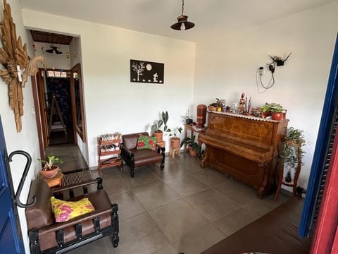 Basic Quadruple Room, Private Bathroom, Courtyard View | Living area