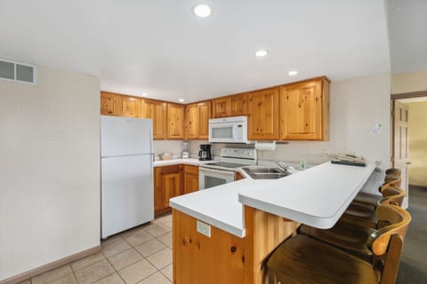 Family Condo | Private kitchen | Toaster, cleaning supplies, freezer, paper towels