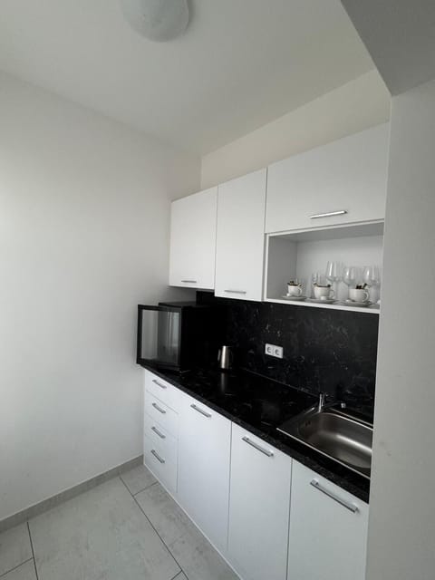 Family Apartment | Private kitchen | Electric kettle, highchair