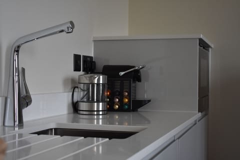 Luxury Suite | Private kitchenette | Coffee/tea maker, electric kettle, highchair